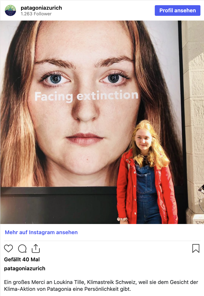 Instagram-Post von @patagoniazurich: Loukina Tille steht vor dem Kampagnen-Plakat 'Facing extinction', auf dem sie selbst abgebildet ist
